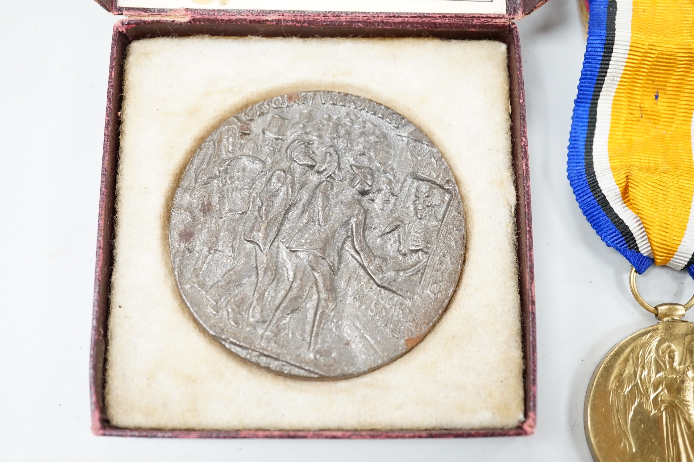 A cased presentation medal, together with a WWI medal pair and a cased RMS Lusitania medallion